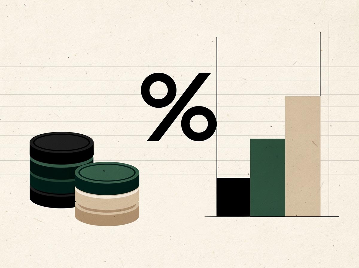 Geometric illustration of coins, a percent motif and tiered bars